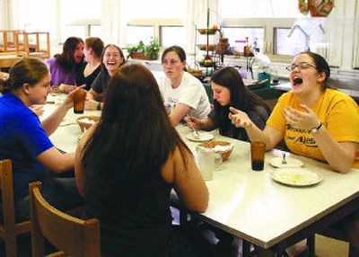 
Cyndil Markert, far right, laughs with her Steel House roommates on the University of Idaho campus in Moscow during one of their nightly community dinners. The University of Idaho announced in March that it would be closing Steel House, the nation's oldest on-campus women's cooperative dorm. 
 (Amanda Smith / The Spokesman-Review)