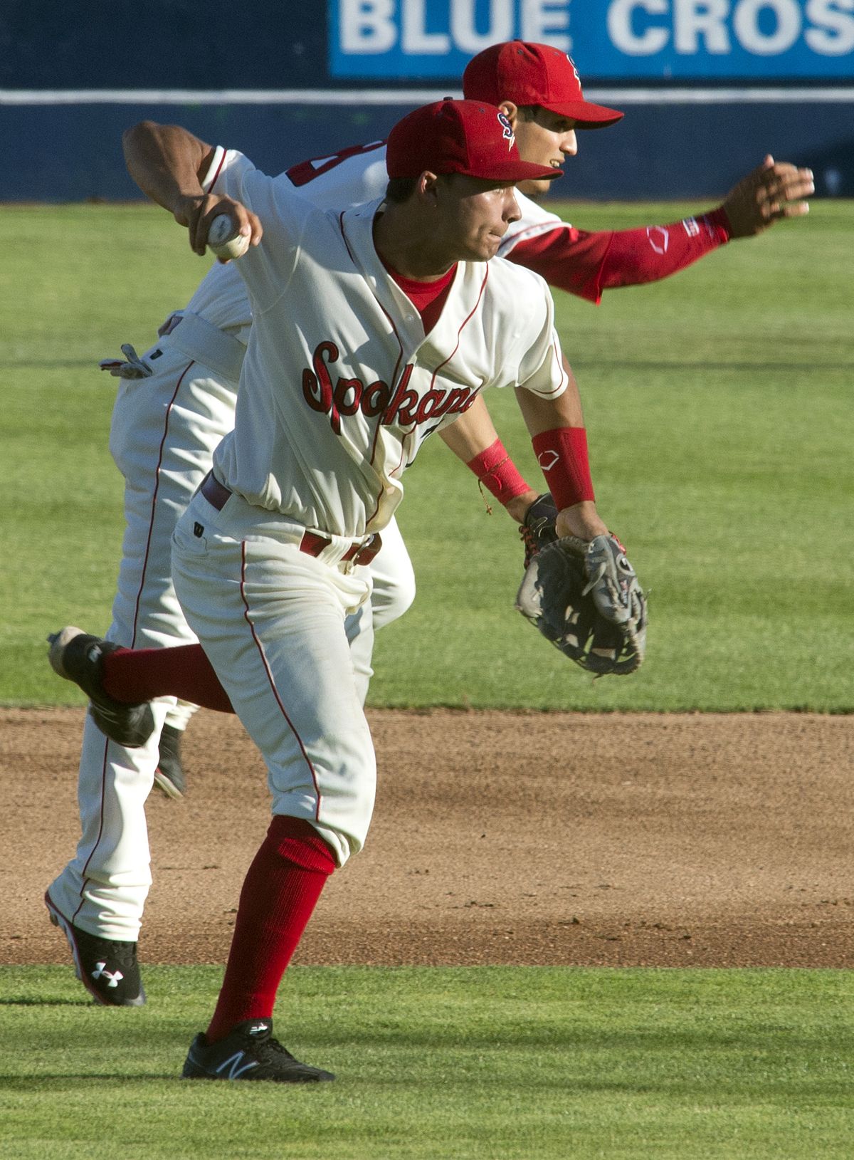 Spokane Indians 2B Evan Van Hoosier throws to first base for the last out of the first. (Dan Pelle)
