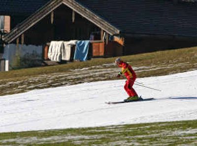 
A skier glides on the remaining snow Tuesday in the area surrounding Ruhpolding, southern Germany. 
 (Associated Press / The Spokesman-Review)