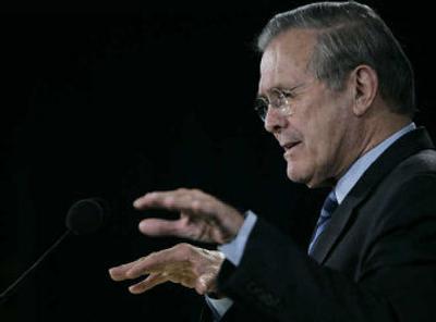 
Secretary of Defense Donald Rumsfeld answers reporters' questions at the Pentagon on Wednesday.
 (Associated Press / The Spokesman-Review)