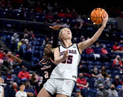 Gonzaga guard Bree Salenbien (35) heads to the basket as Pepperdine forward Rosemary Odebunmi (2) defends during an NCAA college basketball game, Thursday, Feb. 24, 2022, in the McCarthey Athletic Center.  (COLIN MULVANY/THE SPOKESMAN-REVIEW)