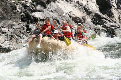 
A boatload of white-water enthusiasts navigate a Class III rapid on the Clark Fork River.
 (Jeff Childre / The Spokesman-Review)