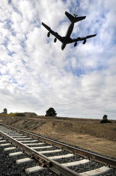 On Friday, a U.S Air Force KC-135 tanker, on approach to Fairchild Air Force Base, flies over a new railroad spur adjacent to land purchased by Spokane County.  (Dan Pelle / The Spokesman-Review)