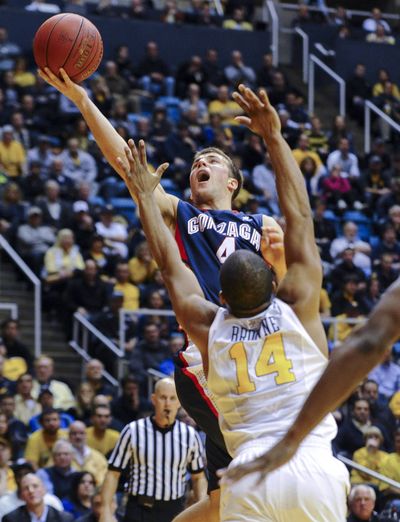 Kevin Pangos, shooting over Gary Browne in the first half, hit three 3-pointers during a decisive 13-0 run for Gonzaga on Tuesday. (Associated Press)