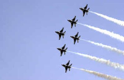 
The Air Force Thunderbirds perform over Fairchild Air Force Base on Saturday during  2004 Skyfest. About 52,000 people attended the event despite temperatures in the 90s. 
 (Jed Conklin / The Spokesman-Review)