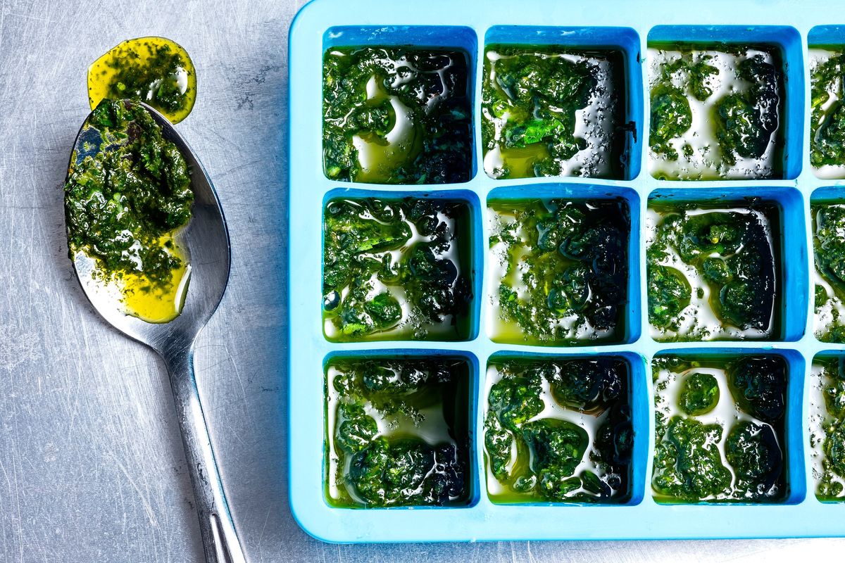 Blend basil into a paste and pop it in the freezer for later.  (Scott Suchman/For the Washington Post)