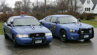 
A Michigan State Police Dodge Charger, right, is shown with a Ford Crown Victoria in Taylor, Mich., on Wednesday. Associated Press
 (Associated Press / The Spokesman-Review)