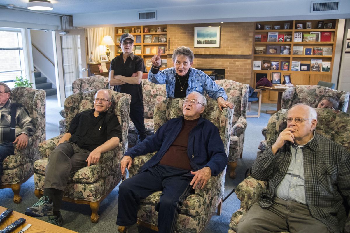 Front row from left, Brother Ted Rohrer, Fr. Paul Cochran, SJ, Fr. Bernard Coughlin, SJ, Dave Thomas, back row, Jolene Van Curler, Dianna Jokela (pointing) and Anna Murphy watching from the GU Cardinal Bea House as the Gonzaga basketball team pops up on television during the NCAA Selection Show, March 12, 2017. The Zags were given a No. 1 seed in the west. (Dan Pelle / The Spokesman-Review)