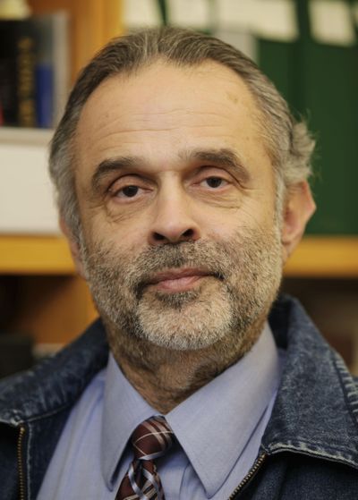 This Feb. 5, 2009, file photo shows Joaquin Avila, in his office in Seattle. (Ted S. Warren / Associated Press)