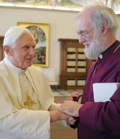 Pope Benedict XVI, left, shakes hands with the Archbishop of Canterbury Rowan Williams at the Vatican on Saturday.  (Associated Press)
