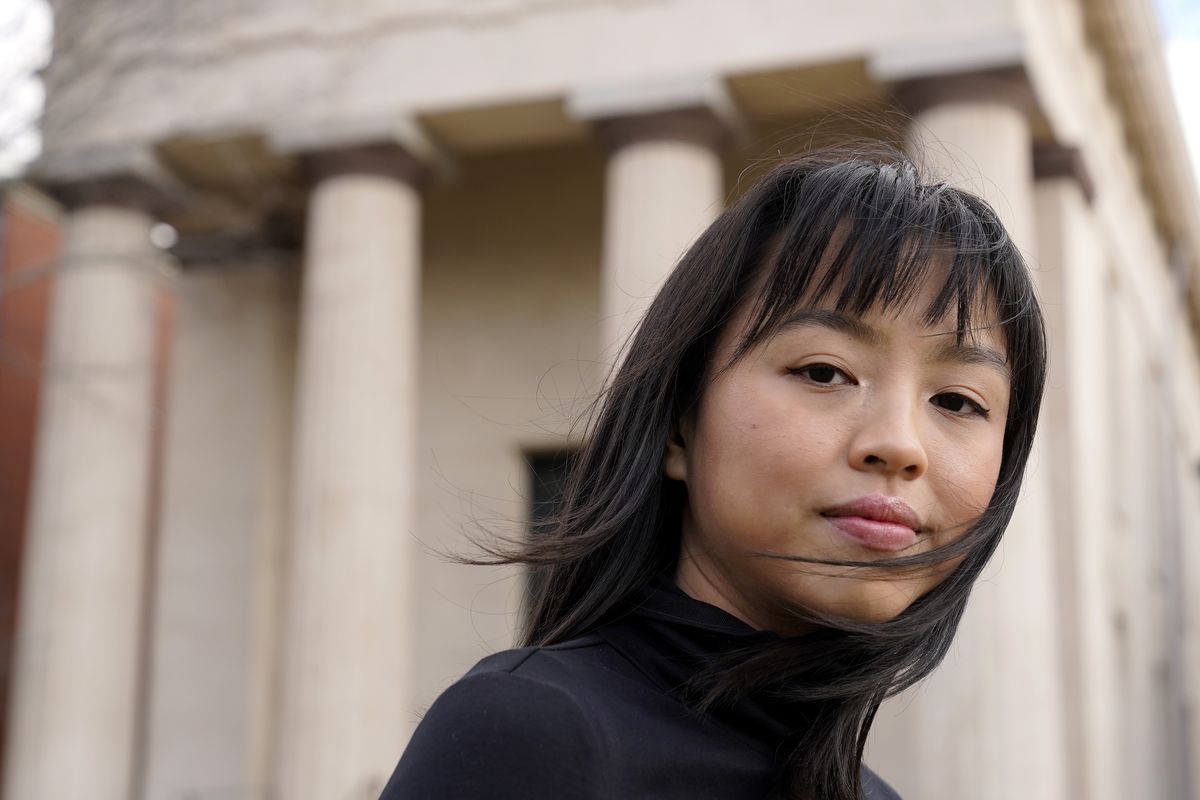 Brown University student Zoe Fuad, of Spring, Texas, stands for a photograph on the Brown campus, in Providence, R.I., Thursday, Feb. 10, 2022. America