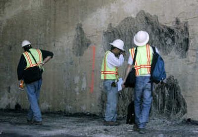 
California Department of Transportation engineers examine the walls of a freeway tunnel north of Los Angeles on Sunday. Associated Press
 (Associated Press / The Spokesman-Review)