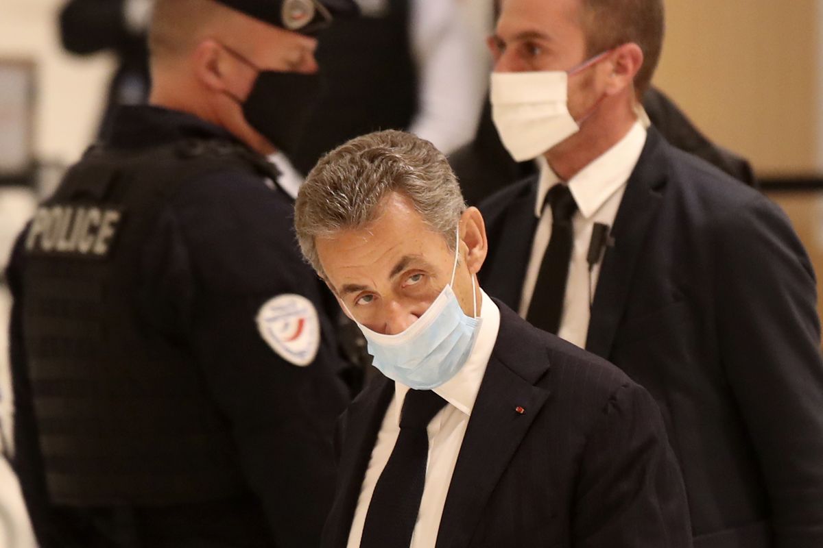 Former French President Nicolas Sarkozy arrives at the courtroom, Monday, Nov. 23, 2020 in Paris. Former French President Nicolas Sarkozy goes on trial Monday on charges of corruption and influence peddling in a phone-tapping scandal, a first for the 65-year-old politician who has faced several other judicial investigations since leaving office in 2012.  (Michel Euler)