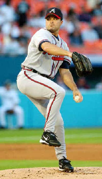 
Starting pitcher Mike Hampton has rediscovered success with Atlanta after a rocky two-year stint in Colorado.
 (Associated Press / The Spokesman-Review)