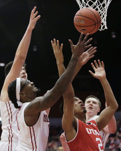 Utah guard Sedrick Barefield (2) and Washington State guard KJ Langston go after a rebound during the second half of an NCAA college basketball game in Pullman, Wash., Wednesday, Jan. 18, 2017. (Young Kwak / AP)