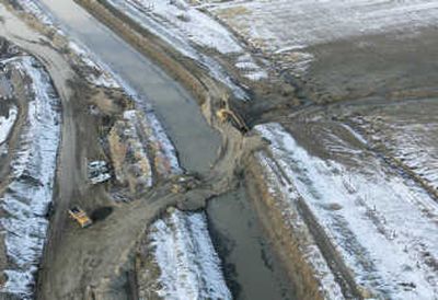 
The levee that broke Saturday in Fernley, Nev.,  is in the process of being repaired Sunday. Associated Press
 (Associated Press / The Spokesman-Review)