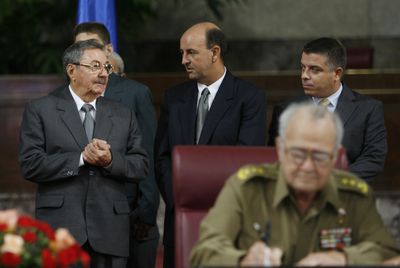 Raul Castro, left, speaks with Vice President Carlos Lage, center, and Foreign Minister Felipe Perez Roque  in Havana in September 2006. Perez Roque was removed from his position Monday, but Lage kept his job in Castro’s shake-up of the Cuban government.  (File Associated Press / The Spokesman-Review)