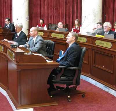 Sen. John McGee, R-Caldwell, sponsor of the bill to ban texting while driving, received at least six other senators' cell phones during the debate on the bill - delivered by Senate pages - after he offered in the debate to adjust another senator's smart-phone. The bill passed, 29-5, and now moves to the House. (Betsy Russell)