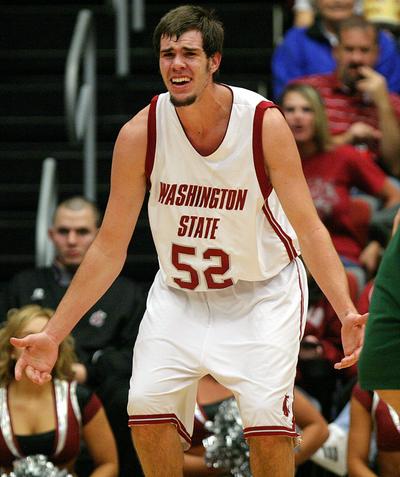 WSU’s Caleb Forrest isn’t in agreement with foul called on him.  (Associated Press / The Spokesman-Review)
