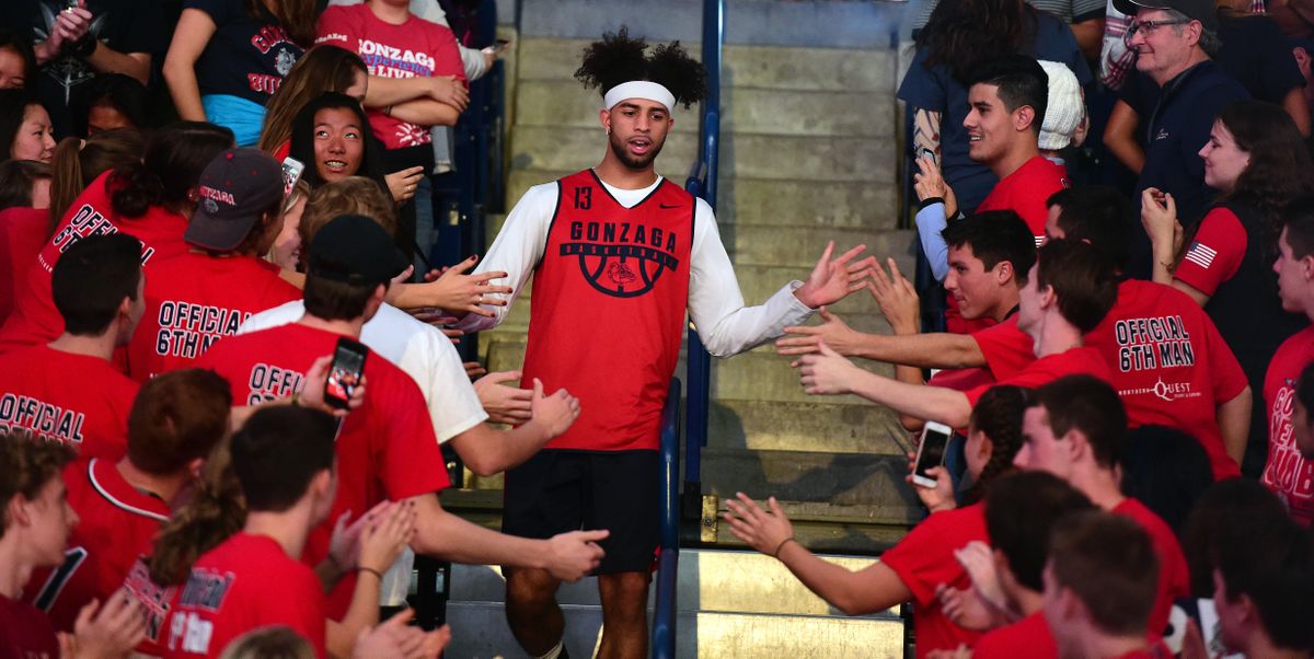Gonzaga guard Josh Perkins (13) makes his way through the student section during player introductions at the Numerica Kraziness in the Kennel event, Sat., Oct. 7, 2017, in the McCarthey Athletic Center. (Colin Mulvany / The Spokesman-Review)