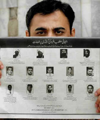 
Pakistani Zafar Ahmed displays a half-page advertisement of U.S. most wanted al Qaeda suspects in Islamabad, Pakistan, on Saturday. The U.S. Embassy advertised the list of 14 most wanted al Qaeda suspects in a Pakistani newspaper, offering rewards of up to $25 million for information leading to their arrest. Pakistani Zafar Ahmed displays a half-page advertisement of U.S. most wanted al Qaeda suspects in Islamabad, Pakistan, on Saturday. The U.S. Embassy advertised the list of 14 most wanted al Qaeda suspects in a Pakistani newspaper, offering rewards of up to $25 million for information leading to their arrest. 
 (Associated Press / The Spokesman-Review)