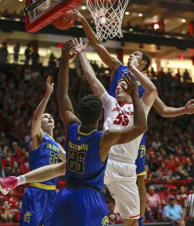 San Jose State’s Brandon Clarke swats a shot by New Mexico’s Connor MacDougall in a Feb. 4 game in Albuquerque. (JUAN ANTONIO LABRECHE / AP)