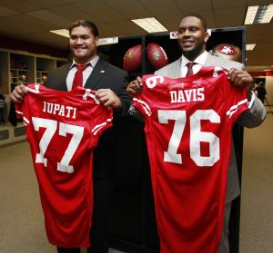San Francisco 49ers first-round draft picks Mike Iupati, left, a guard from Idaho, and Anthony Davis, right, tackle from Rutgers, pose in the locker room at 49ers headquarters in Santa Clara, Calif., Friday, April 23, 2010. (Paul Sakuma / Associated Press)