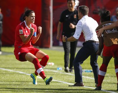 Christine Sinclair rushes toward head coach John Herdman after she scored the winning goal Saturday in Canada’s 1-0 victory over China at the Women’s World Cup. (Associated Press)