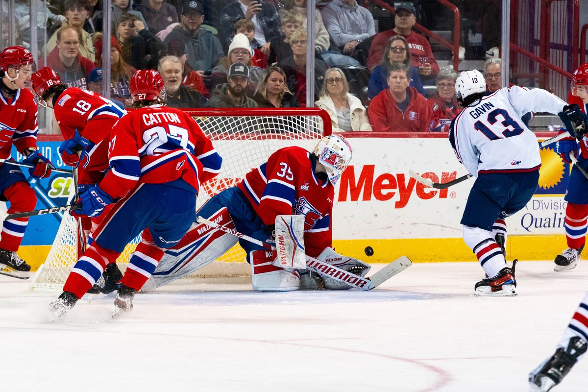 Spokane Chiefs Dawson Cowan makes one of his __ saves against the Tri-City Americans in a __ win at Spokane Arena on Dec. 30, 2023.   (Larry Brunt/Spokane Chiefs)