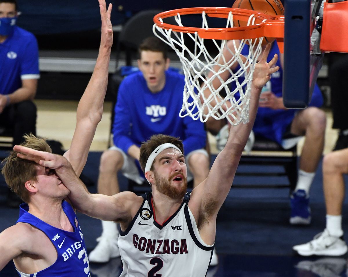 Gonzaga forward Drew Timme (2) fends off the defense of Brigham Young forward Matt Haarms (3) to score 2-points during the first half of an NCAA college basketball game, Thurs., Jan. 7, 2021, in the McCarthey Athletic Center.  (Colin Mulvany/THE SPOKESMAN-REVIEW)