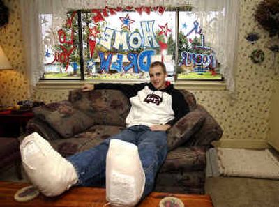 
University High 2003 graduate Drew Schaefer returned from eight months in Iraq with two crushed feet. His family decorated their front window to welcome him home. 
 (Liz Kishimoto / The Spokesman-Review)