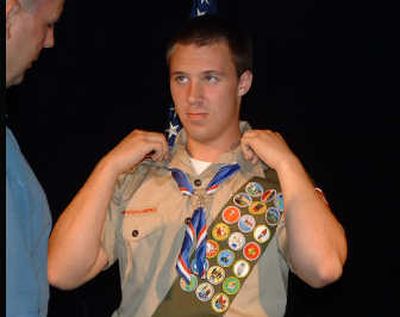 
Eagle Scout Kris Sampson is prepped by former assistant scoutmaster Mario Tedesco to be photographed for his official Boy Scout bio prior to a ceremony at Fairchild Air Force Base earlier this month. Special to 
 (Ryan Lancaster  Special to / The Spokesman-Review)