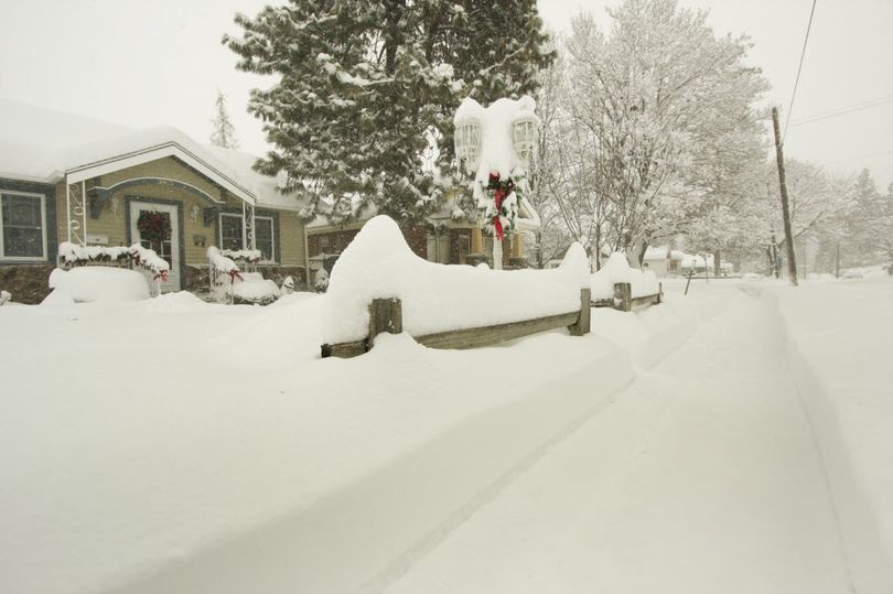 This Dec. 18, 2008, photo shows a snow-blown sidewalk covered in snow. According to weather experts, Spokane has a white Christmas about 70 percent of the time. (Associated Press)