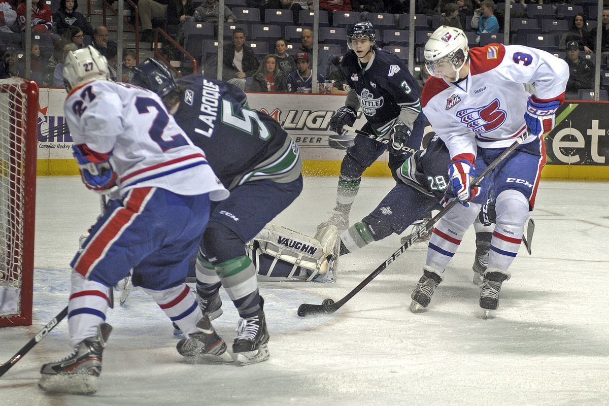Davis Vandane (3) of the Spokane Chiefs backhands a shot past Seattle goalie Calvin Pickard for a 2-1 Spokane lead in a busy first period. (Christopher Anderson)