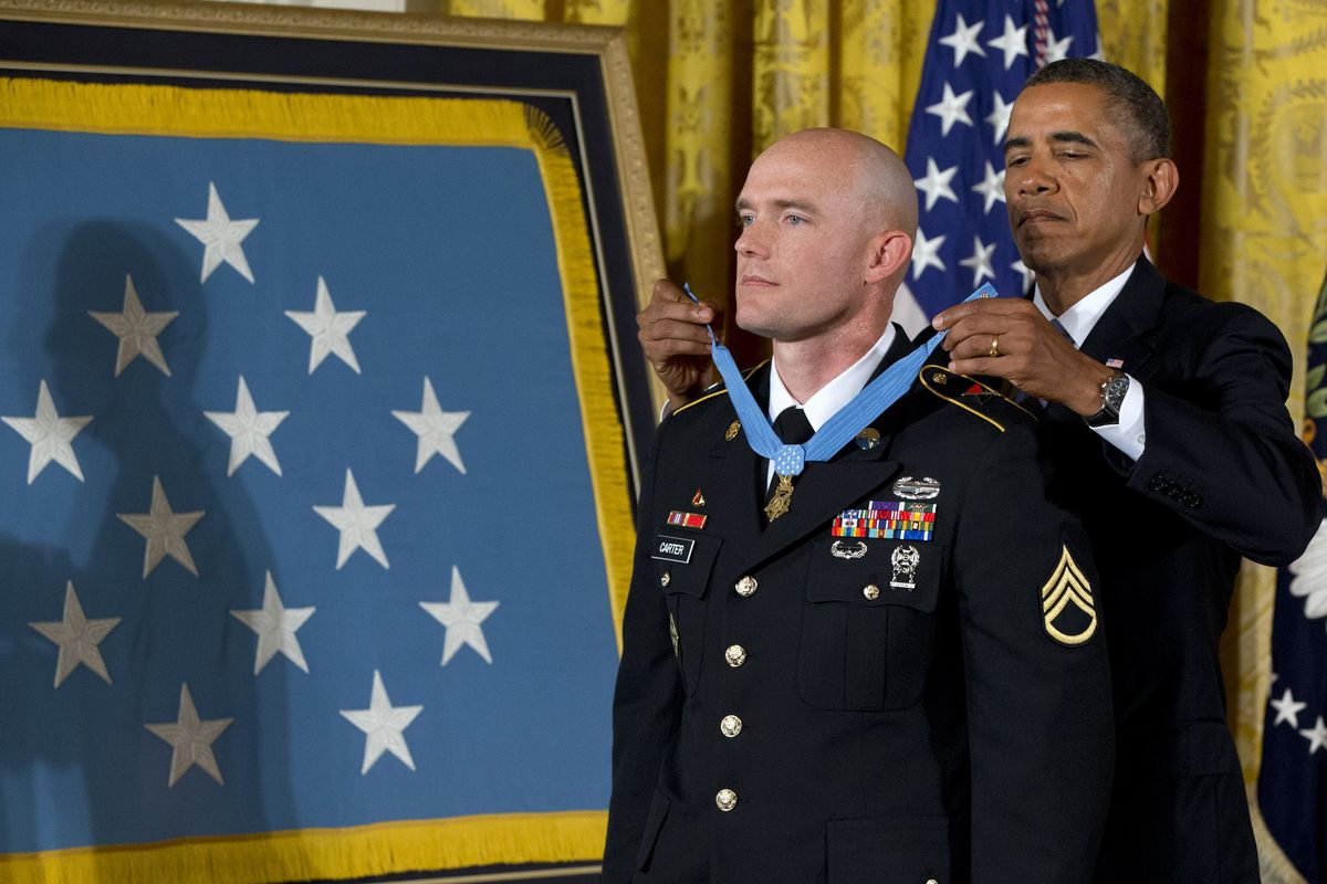 President Barack Obama awards U.S. Army Staff Sgt. Ty Carter the Medal of Honor for conspicuous gallantry, at the White House on Aug. 26. (Associated Press)