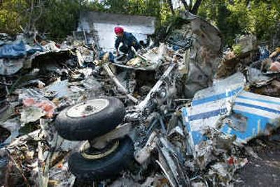 
Crews search the wreckage near the village of Gluboky.
 (EPA / The Spokesman-Review)