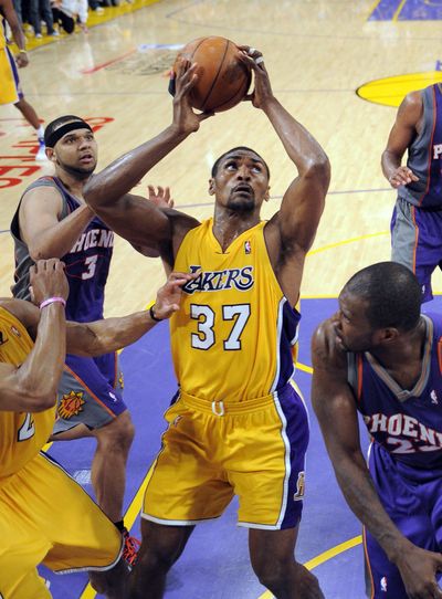 Ron Artest puts up the winning shot as the Lakers defeated the Suns in Game 5 Thursday night.   (Associated Press)