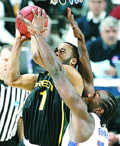 
Oregon's Malik Hairston (1) meets Florida's Chris Richard. 
 (Associated Press / The Spokesman-Review)