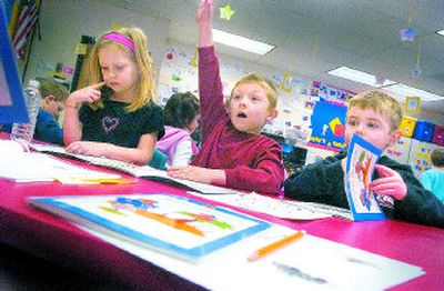 
From left, Elizabeth Lynch, Thomas Perryman and Cameron Wright ponder a question from Liberty Elementary School kindergarten teacher Becky Smith on Feb. 7. The Liberty School District offers full-day kindergarten to its students. 
 (CHRISTOPHER ANDERSON / The Spokesman-Review)