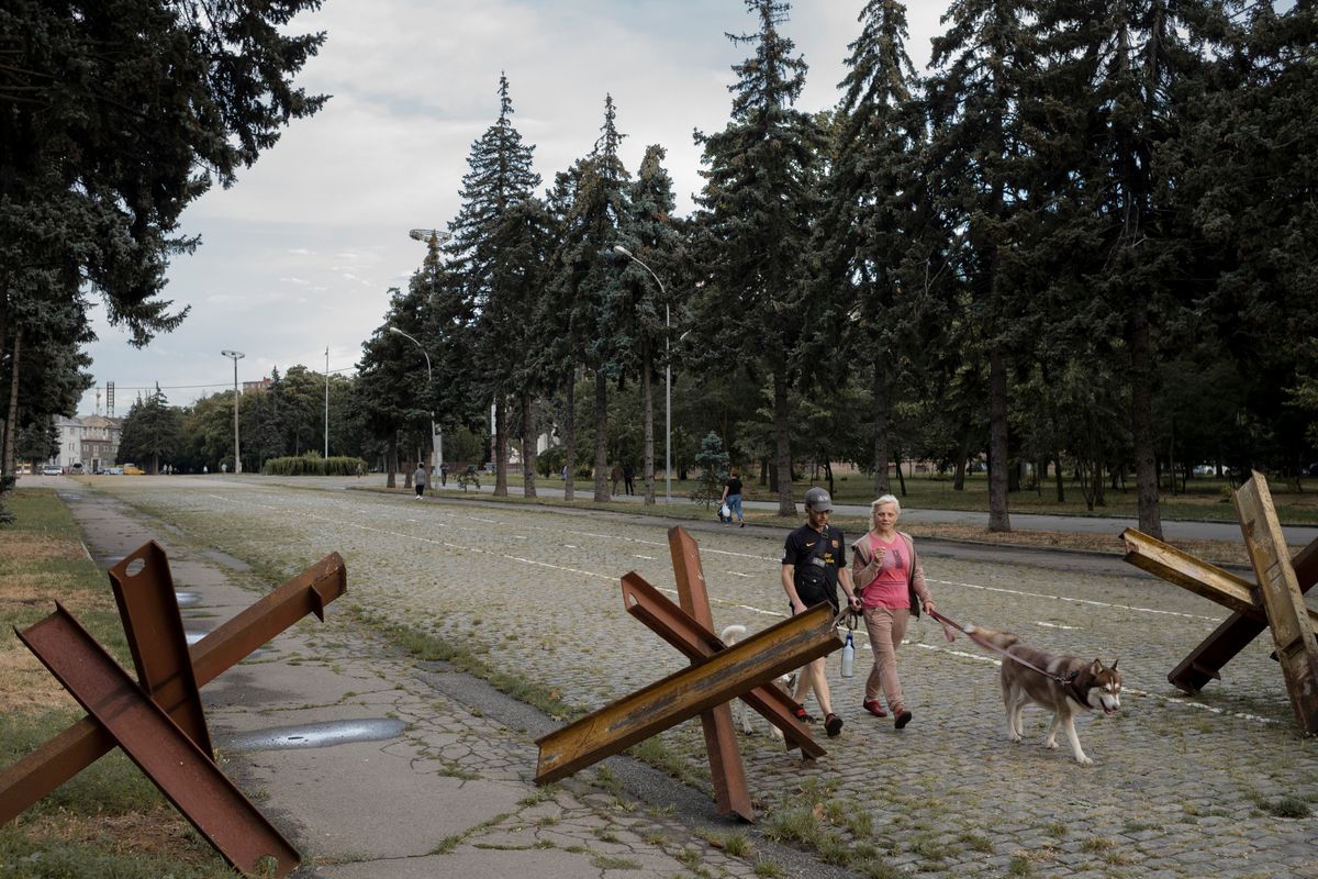 Pedestrians passing anti-tank obstacles in Odesa, Ukraine on July 27, 2023. Russian bombardments have not only stiffened the will to resist, residents there said, but ratcheted up a sense of loathing for the invaders. (Emile Ducke/The New York Times)  (EMILE DUCKE)
