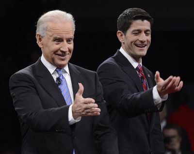 Vice President Joe Biden, left, and Republican vice presidential nominee Wisconsin Rep. Paul Ryan motion toward the audience following their debate Thursday night at Centre College in Danville, Ky. (Associated Press)