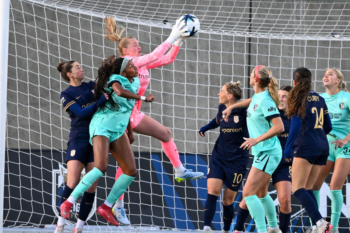 Seattle Reign FC goalkeeper Claudia Dickey (1) stops a corner kick during the first half a NWSL women’s soccer game with Kansas City, Wed., March 25, 2026, at ONE Spokane Stadium.  (Colin Mulvany/The Spokesman-Review)