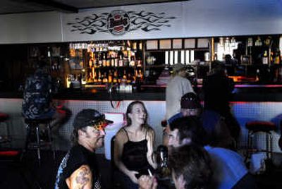 Friends and customers mingle at Borrowed Bucks Roadhouse on Sunday. The business on Hauser Lake opened recently after extensive remodeling.
(Photos by BRIAN PLONKA / The Spokesman-Review)