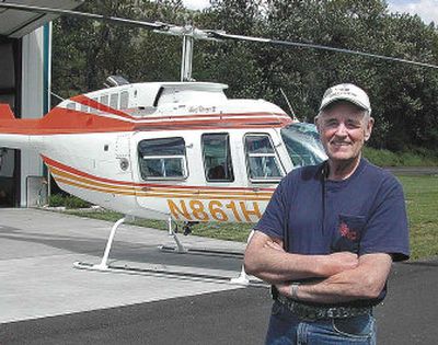 
Ray Reel of Orofino, Idaho, stands next to a Bell Jet Ranger at Orofino Airport. Reel has logged nearly 15,000 hours of fight time, including an evacuation of a downed pilot near Kooskia, Idaho.
 (Associated Press / The Spokesman-Review)