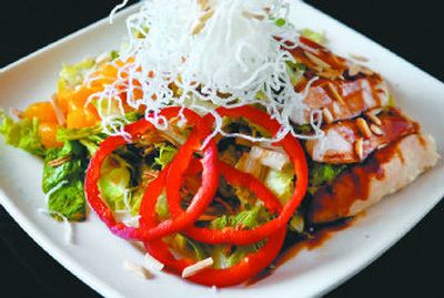 
The Mandarin Chicken Salad at Prospectors Bar and Grill is prepared without trans fats. Below: The cooking line at Prospectors uses Butter-It, curry oil, canola oil and white wine in place of saturated and trans fats. 
 (Photos by Dan Pelle / The Spokesman-Review)
