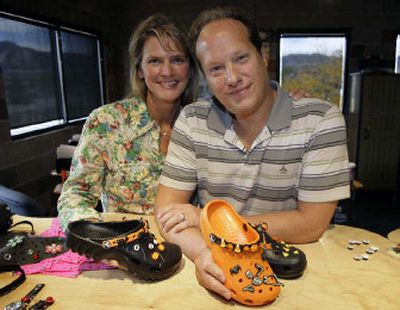 
Sheri and Rich Schmelzer show off some of the accessories that they sell to adorn Crocs in the couple's office in Boulder, Colo. Their creativity paid off Tuesday with an agreement to sell the business to Crocs Inc. for $10 million. 
 (Associated Press / The Spokesman-Review)
