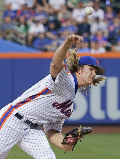 New York Mets' Noah Syndergaard was immediately ejected after throwing behind Los Angeles Dodgers’ Chase Utley in the third inning. (Frank Franklin II / Associated Press)