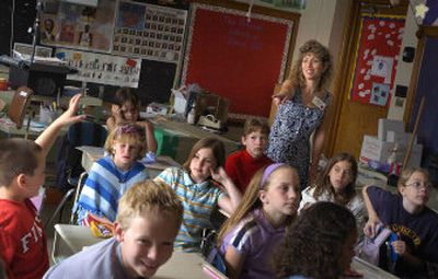 
Shannon Sullivan volunteers at her son Dylan's (facing forward at bottom left) elementary school. 