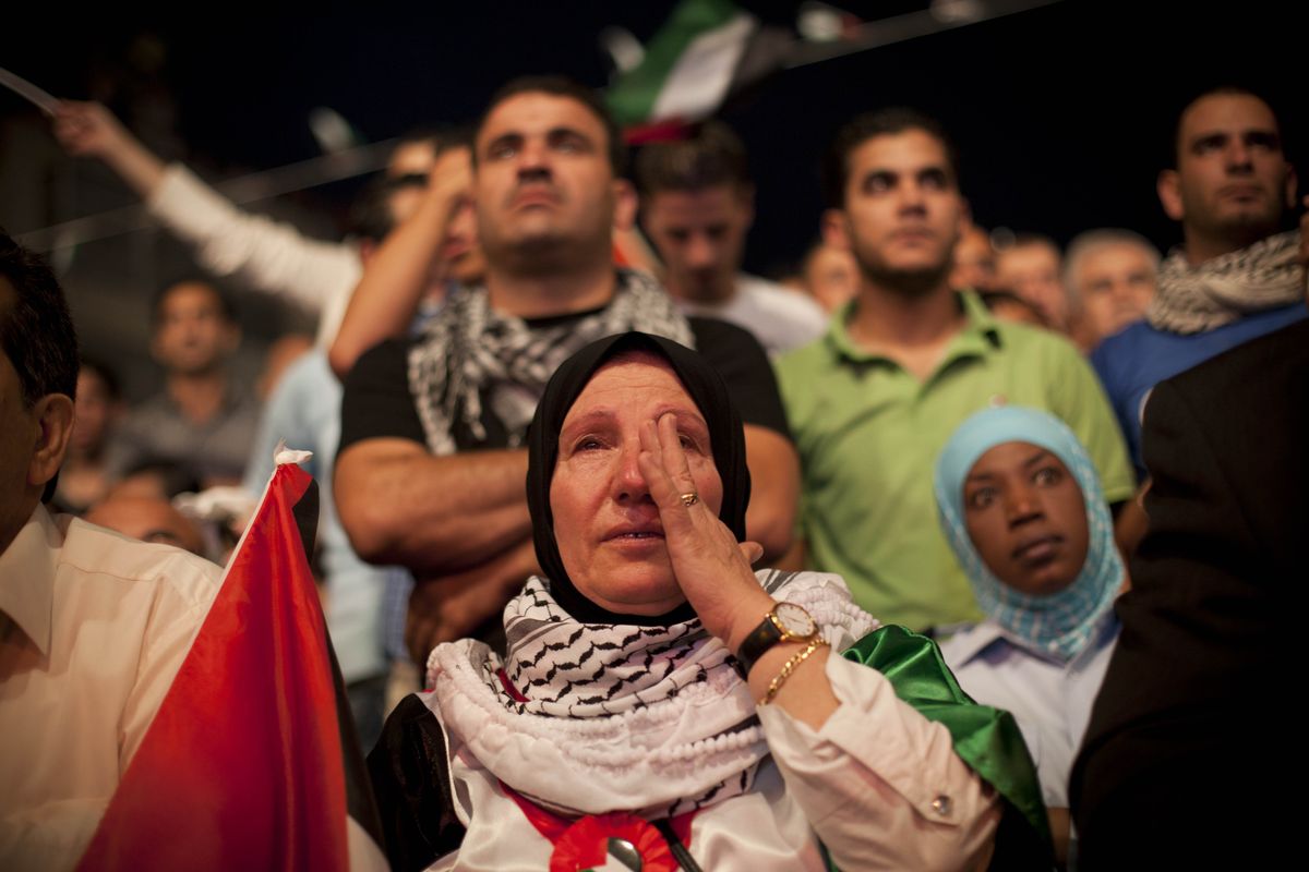 A Palestinian woman cries during the speech of President Mahmoud Abbas at the General Assembly of the United Nations, in  the West Bank city of Ramallah, Friday, Sept. 23, 2011. (Bernat Armangue / Associated Press)