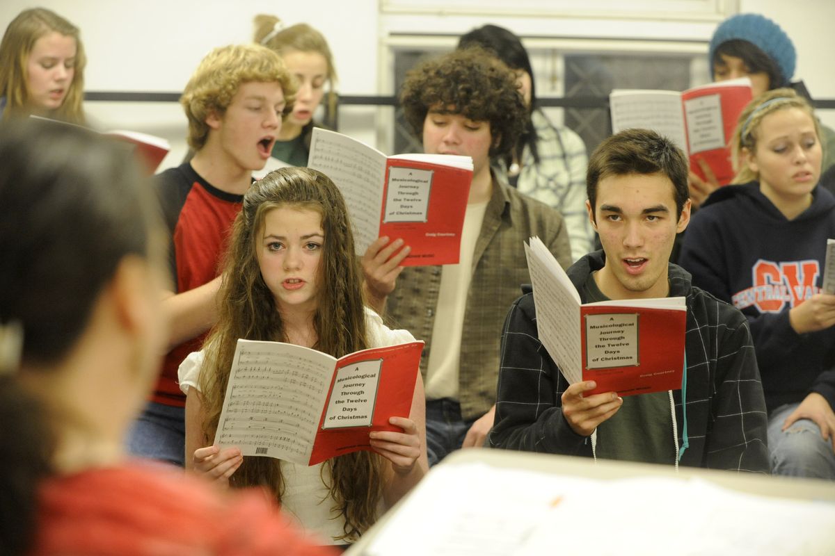 Teenage singers practice holiday songs during rehearsal  Dec. 8 at Westminster Congregational Church. Choir members range in age from 7 to 18. (Jesse Tinsley)